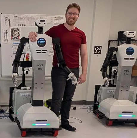 Steven Rice demonstrating humanoid robots at the Humanoid Application Lab